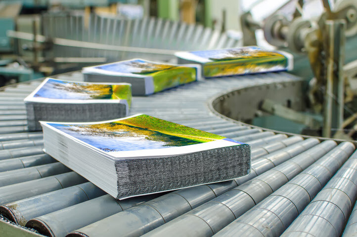 Colorful printed books on a production line at a modern printing press