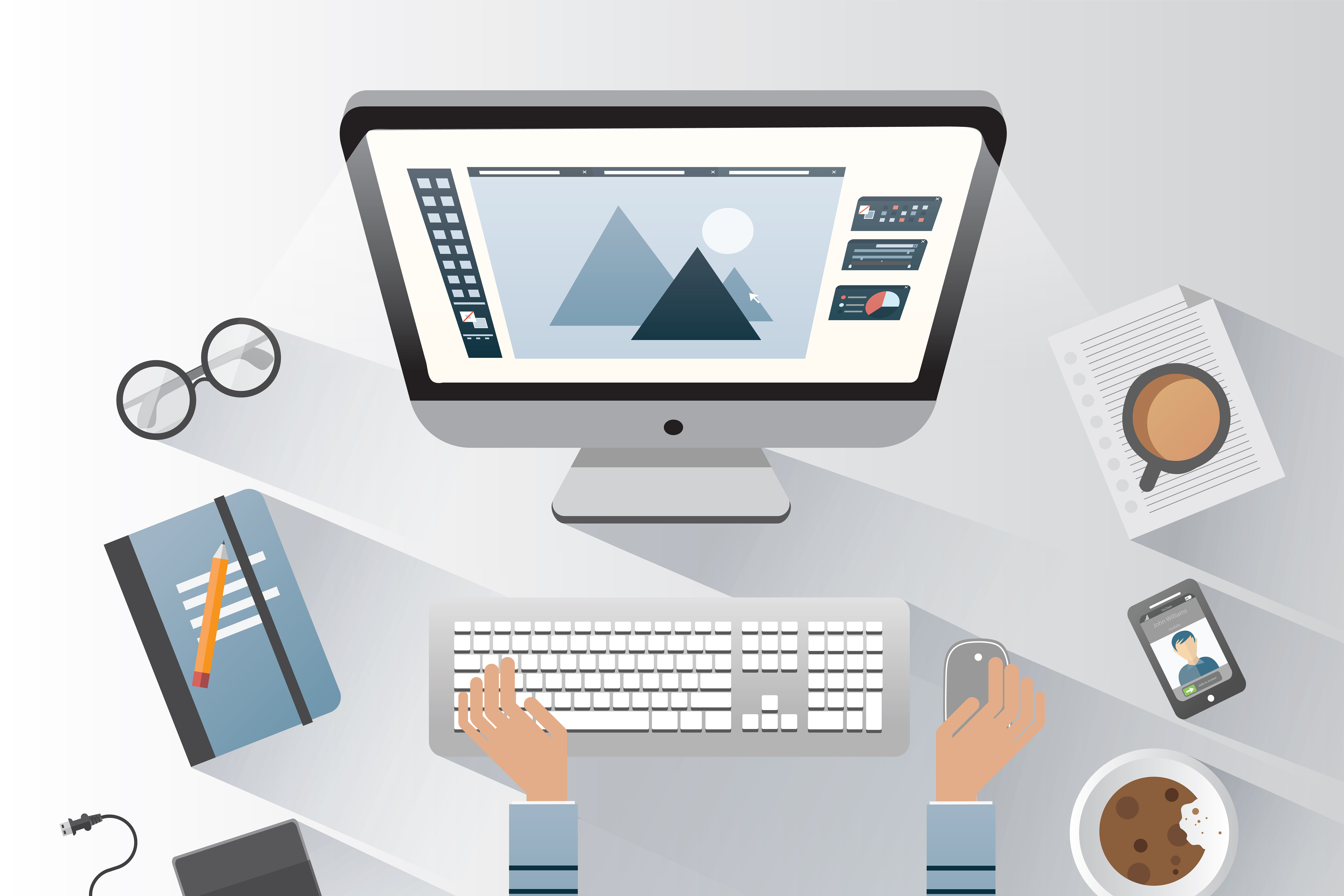 Modern desk setup with computer design software open, person working with keyboard and mouse