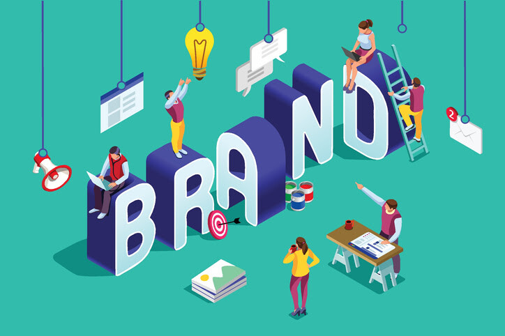 Illustration of people building a brand with large 3D letters, marketing icons, and creative tools representing brand awareness.