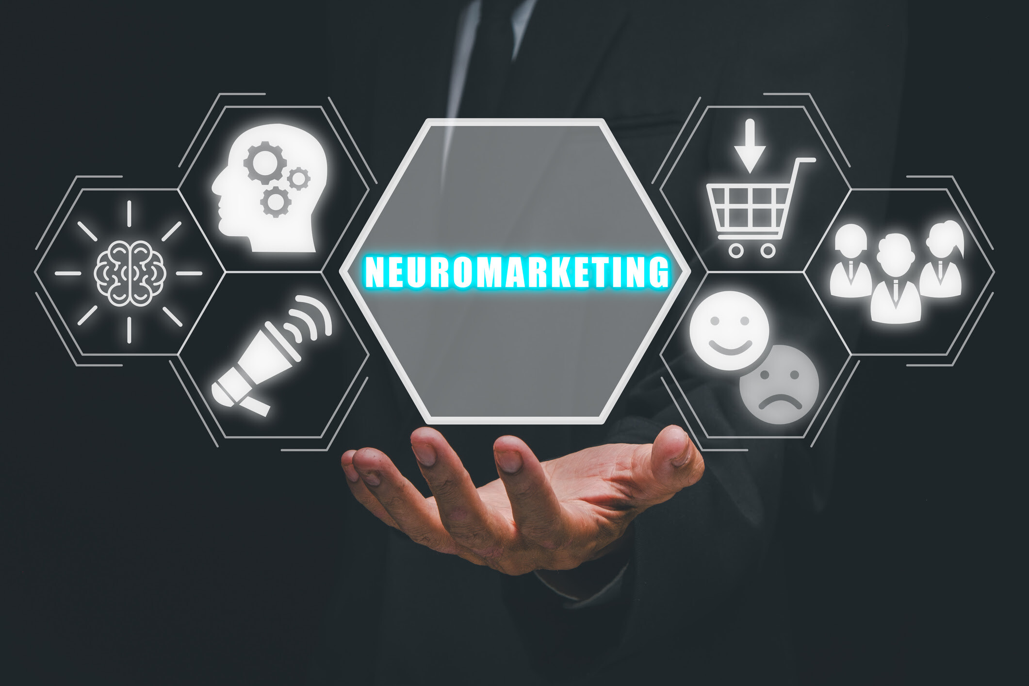 Businessman presenting neuromarketing concept with hexagonal icons and glowing text.