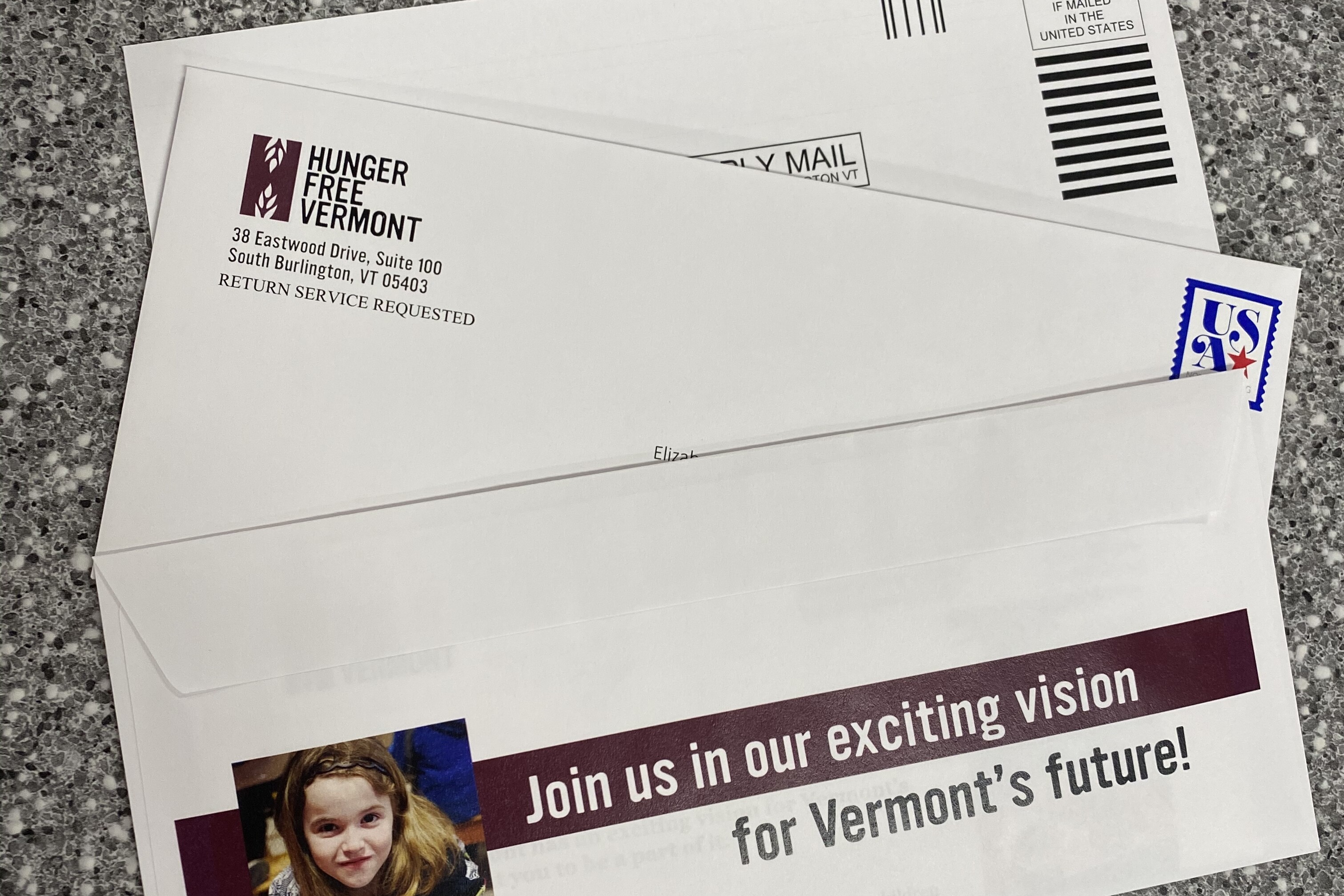 Hunger Free Vermont envelope with a child’s image and call to action for Vermont’s future.