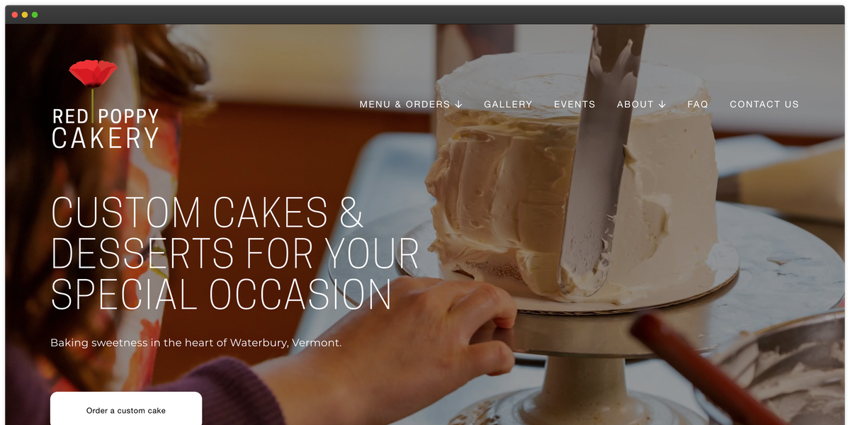 Screenshot of Red Poppy Cakery??'s website: A hand icing a cake on a rotating stand with bakery branding in the background.